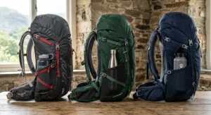 A side profile comparison of three top rated 40l rucksacks showing compression straps and mesh water bottle pockets