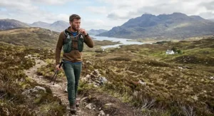 Hill walker with the best hydration pack trekking across the Scottish Highlands