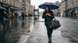 A water-resistant foldable lightweight holdall carried outdoors during a light British drizzle